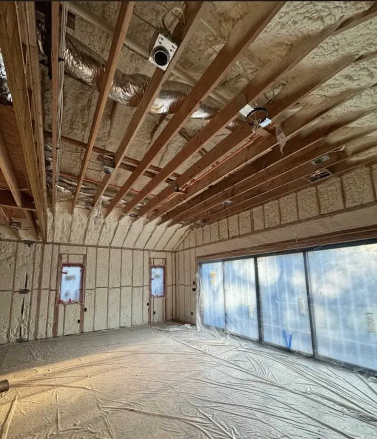 Interior walls and ceiling insulated with spray foam during new construction in Huntington Beach